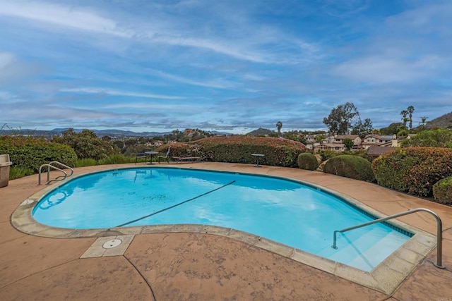 pool with a patio area