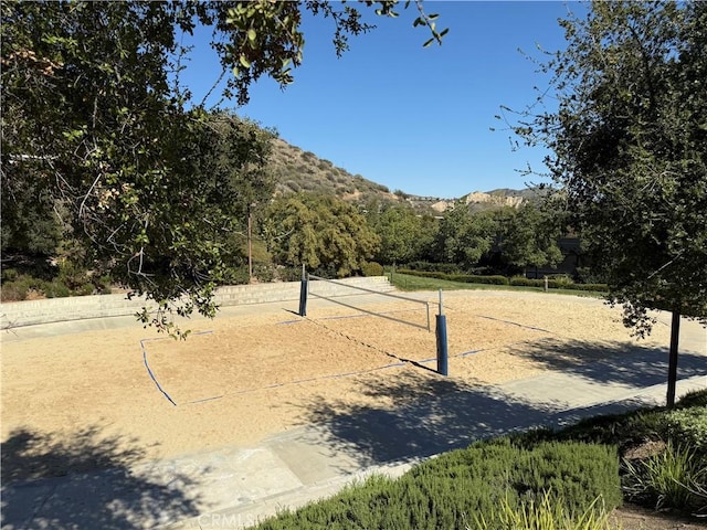 view of home's community featuring a mountain view and volleyball court