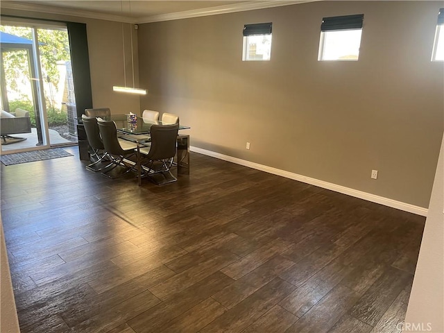 dining space featuring a wealth of natural light, baseboards, dark wood-style flooring, and crown molding