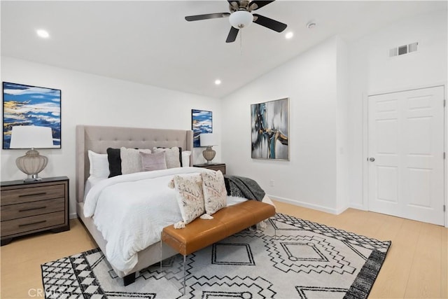 bedroom featuring visible vents, ceiling fan, lofted ceiling, recessed lighting, and wood finished floors