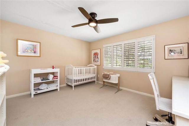 bedroom featuring ceiling fan, baseboards, and carpet floors