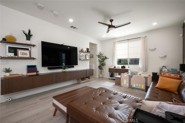 living area with visible vents, recessed lighting, a ceiling fan, and wood finished floors