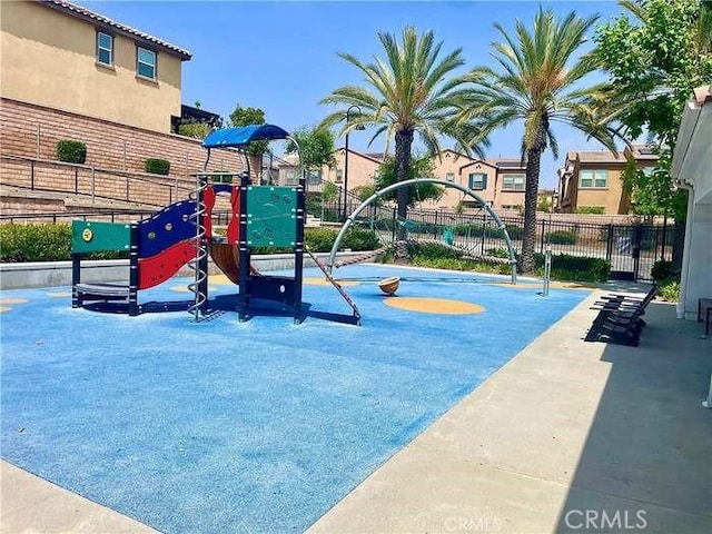 community play area featuring fence