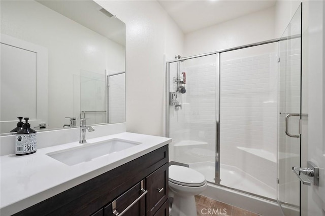 full bathroom featuring vanity, toilet, wood finished floors, and a stall shower