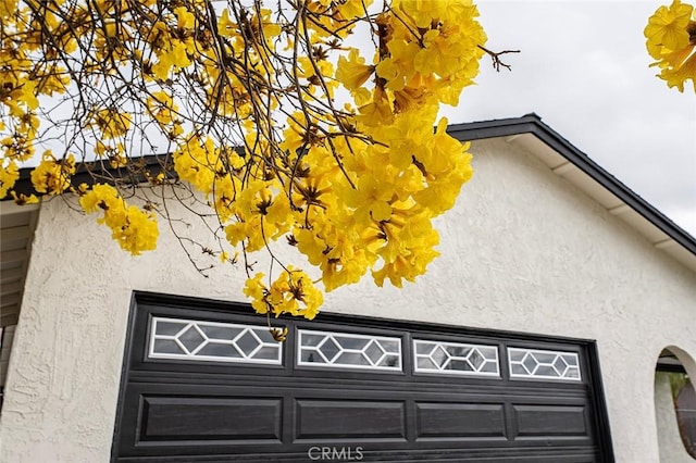 exterior details featuring stucco siding