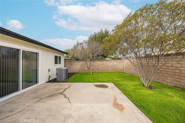 view of patio featuring a fenced backyard and central AC