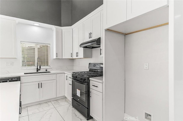 kitchen with marble finish floor, under cabinet range hood, a sink, white dishwasher, and black range with gas cooktop