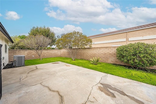 view of patio with central AC unit and a fenced backyard