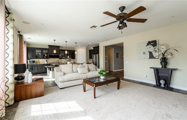 living area featuring a ceiling fan, recessed lighting, baseboards, and visible vents