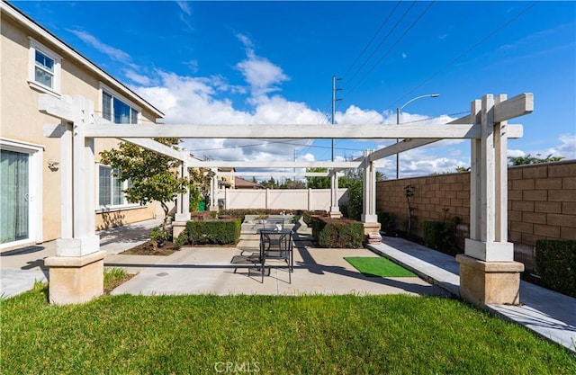 exterior space with a patio area, a fenced backyard, and a pergola