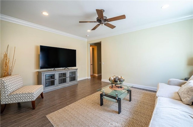 living room featuring crown molding, baseboards, recessed lighting, wood finished floors, and a ceiling fan