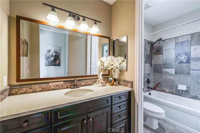 bathroom featuring vanity, toilet, and tub / shower combination