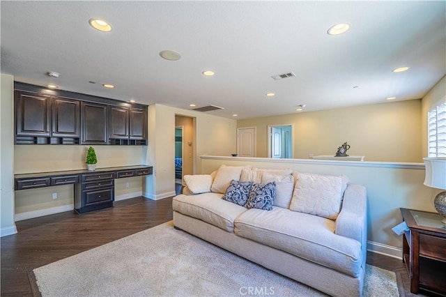 living area featuring recessed lighting, visible vents, and dark wood finished floors