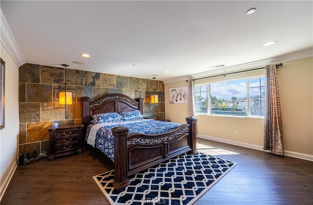 bedroom featuring visible vents, baseboards, ornamental molding, recessed lighting, and wood finished floors