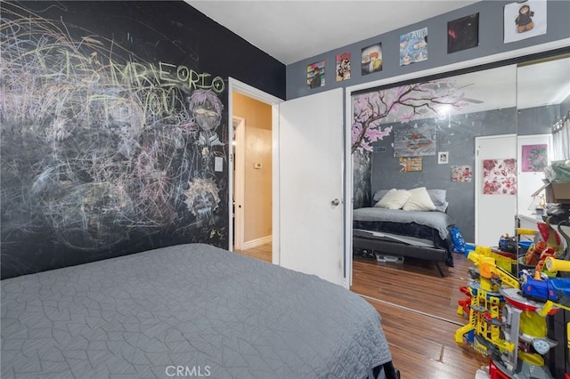 bedroom with wood finished floors