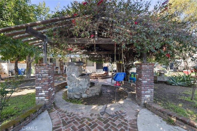 view of patio featuring fence and a pergola