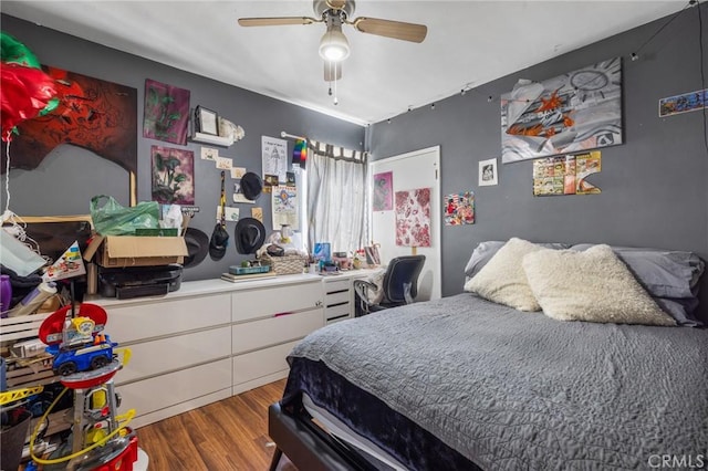 bedroom with a ceiling fan and wood finished floors