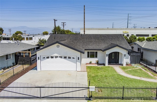 view of front facade featuring driveway, a fenced front yard, and stucco siding