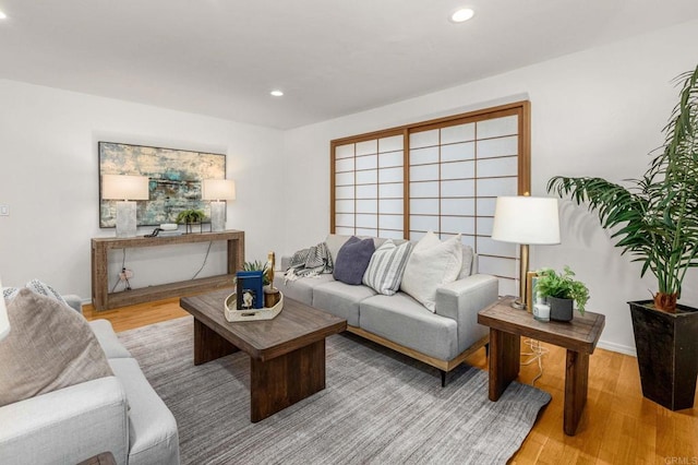 living room featuring recessed lighting and wood finished floors