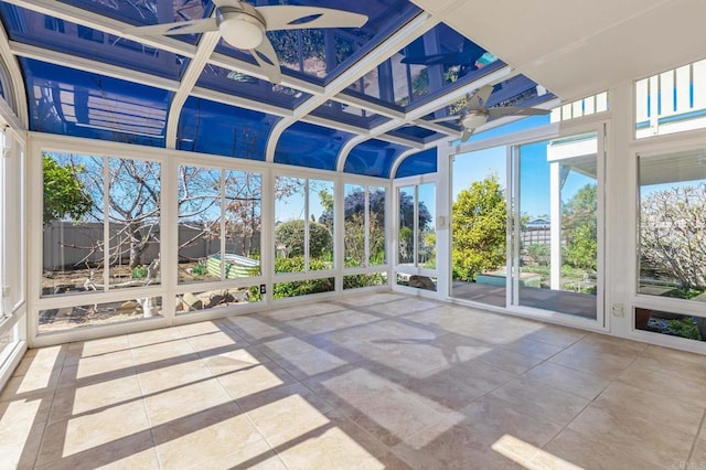 unfurnished sunroom with coffered ceiling and ceiling fan