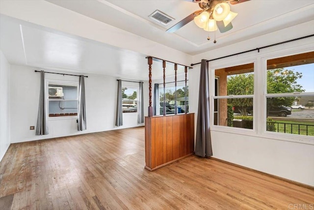 interior space with visible vents, light wood-style flooring, and ceiling fan