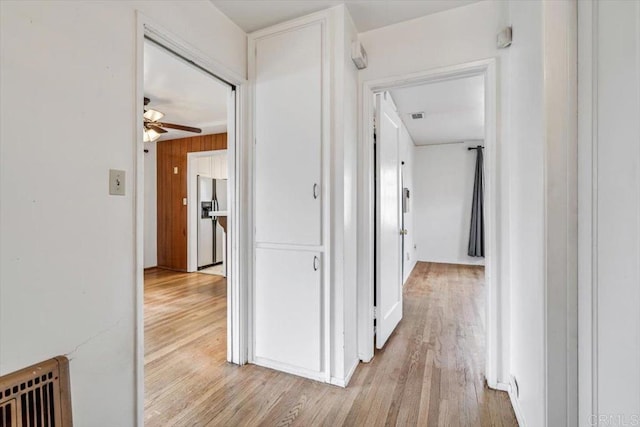 hall with visible vents and light wood-style flooring