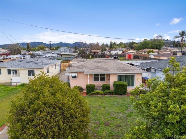 exterior space with a mountain view and a residential view