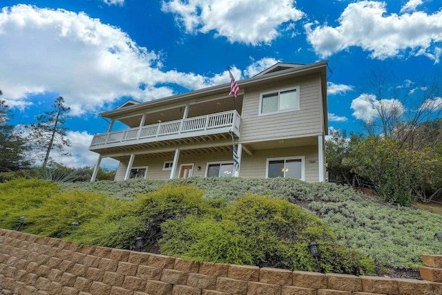 rear view of property with a balcony