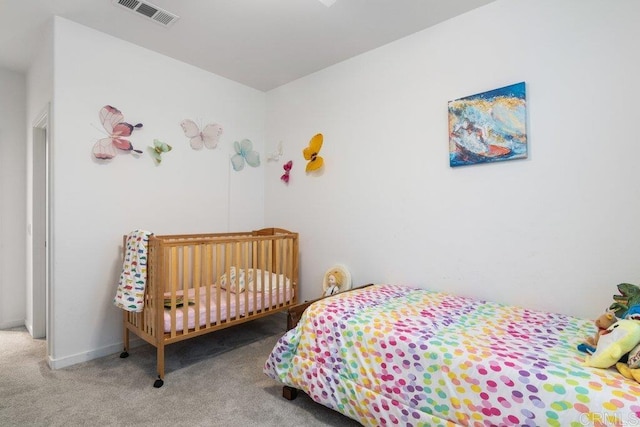 bedroom with visible vents, baseboards, and carpet