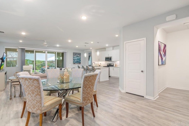 dining area featuring recessed lighting, light wood-style flooring, visible vents, and baseboards