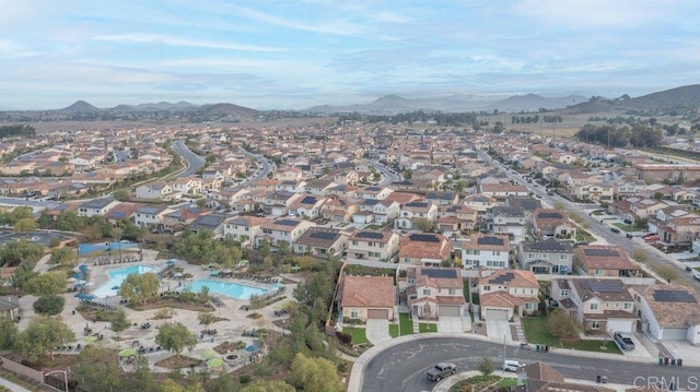 drone / aerial view featuring a mountain view and a residential view