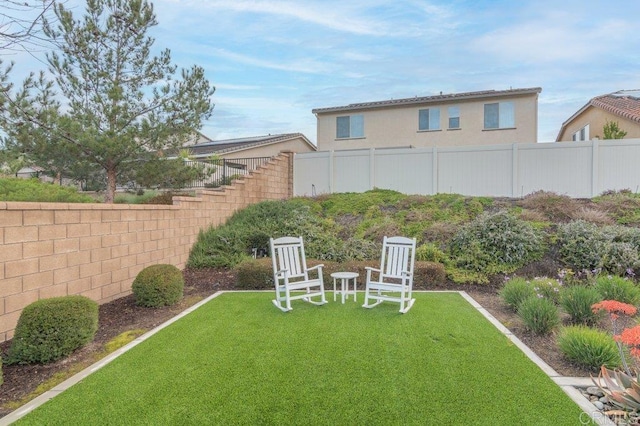 view of yard featuring fence