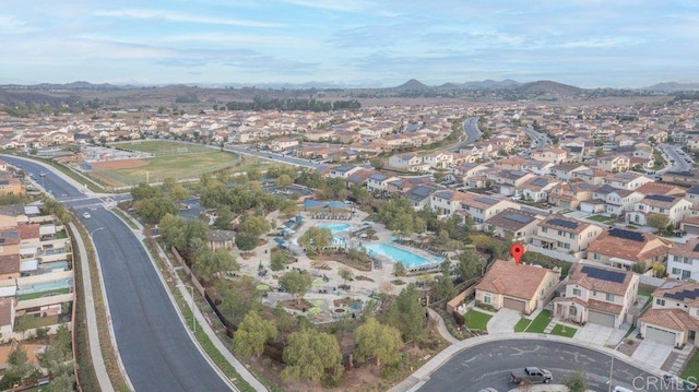 birds eye view of property featuring a mountain view and a residential view