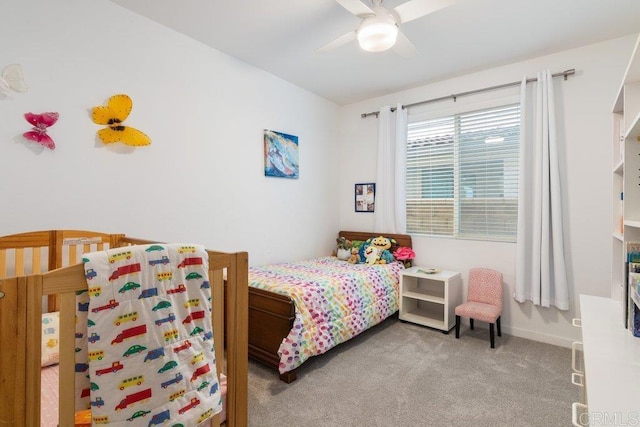 bedroom with baseboards, ceiling fan, and carpet floors