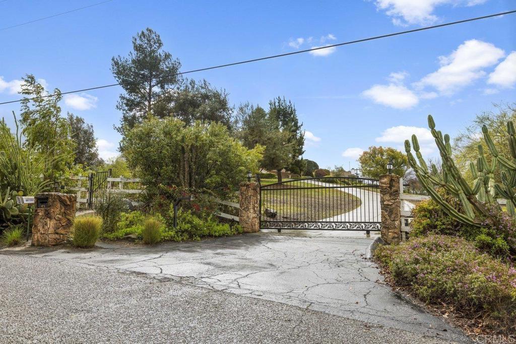 view of gate with fence