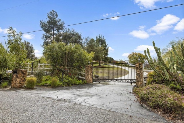 view of gate with fence