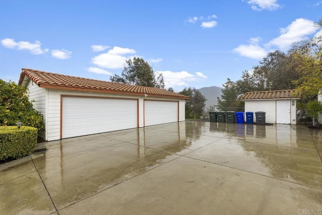 detached garage featuring a mountain view