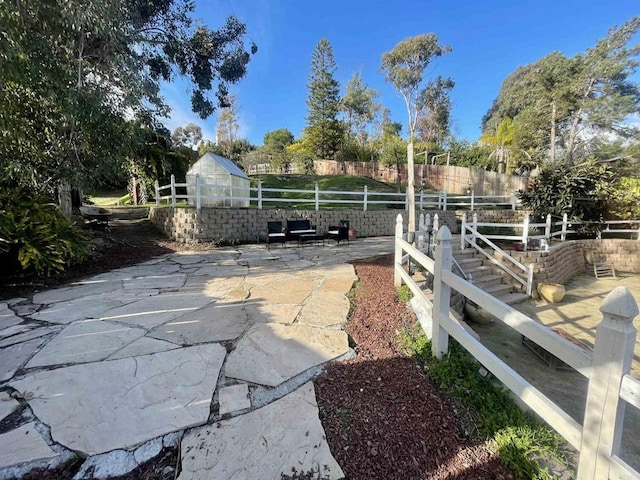 view of yard with a patio and fence