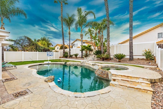 view of pool featuring a patio, a fenced backyard, and a pool with connected hot tub