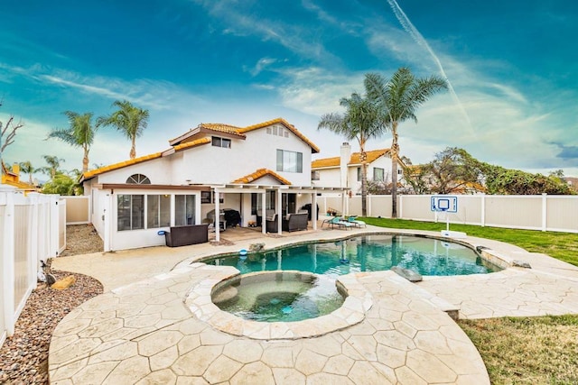 view of swimming pool with an in ground hot tub, a fenced backyard, a fenced in pool, and a patio