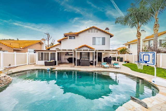 view of pool with a fenced in pool, an outdoor living space, a fenced backyard, a sunroom, and a patio