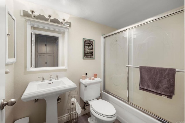 29600 Nightcrest Cir, Temecula, CA 92591 - bathroom featuring toilet and bath / shower combo with glass door