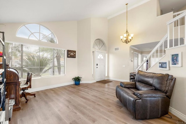 29600 Nightcrest Cir, Temecula, CA 92591 - living room with light wood finished floors, baseboards, a chandelier, stairway, and high vaulted ceiling