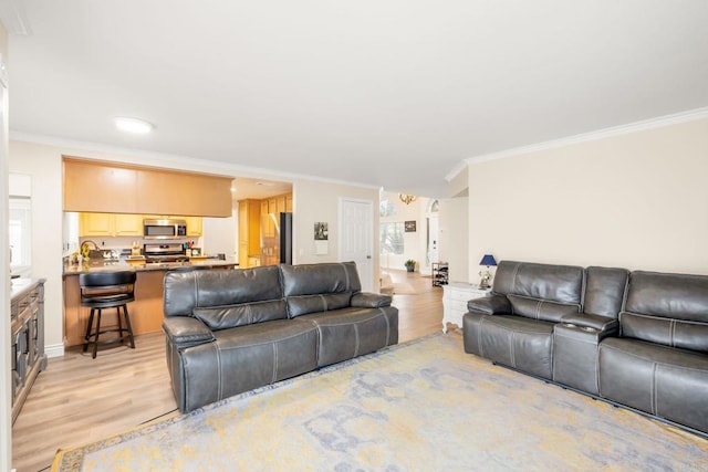 29600 Nightcrest Cir, Temecula, CA 92591 - living room featuring light wood finished floors and crown molding