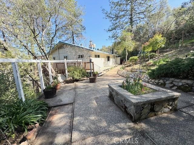 exterior space with a patio area and a wooden deck