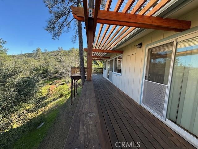 wooden terrace featuring a pergola