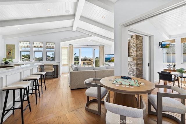 dining room featuring recessed lighting, light wood-style flooring, wood ceiling, and lofted ceiling with beams