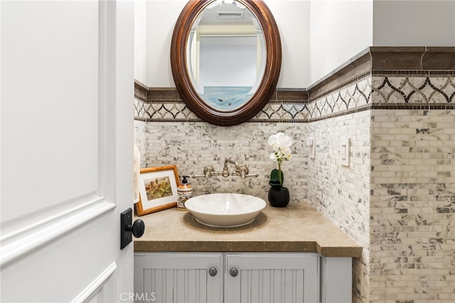 bathroom featuring visible vents and vanity