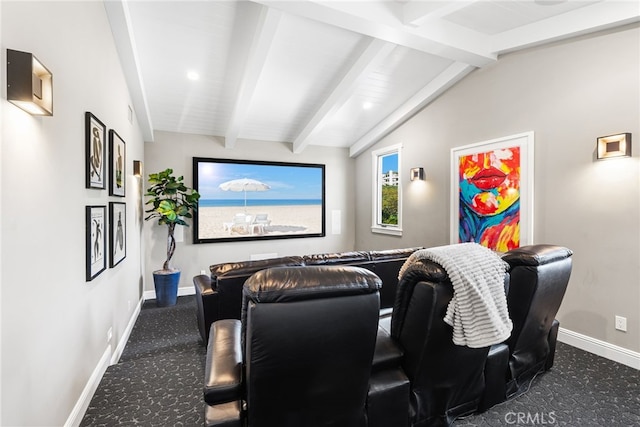 home theater room with baseboards, carpet, and vaulted ceiling with beams