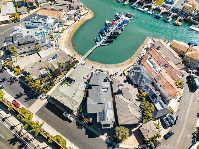 birds eye view of property with a residential view and a water view